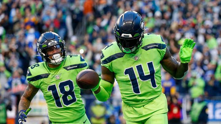 Oct 7, 2021; Seattle, Washington, USA; Seattle Seahawks wide receiver DK Metcalf (14) celebrates with wide receiver Freddie Swain (14) after catching a touchdown pass against the Los Angeles Rams during the second quarter at Lumen Field. Mandatory Credit: Joe Nicholson-USA TODAY Sports